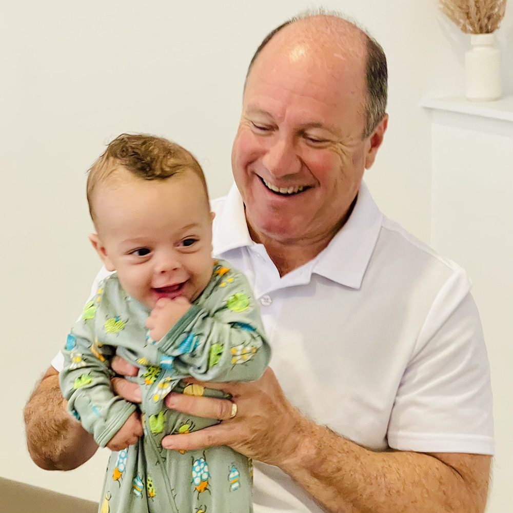 Dr. Jonathan Amdur holding a baby